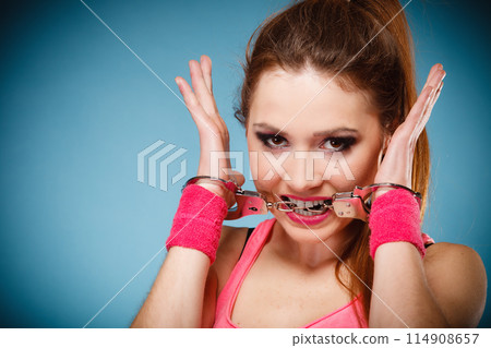 teen crime - teenager girl in handcuffs teen crime - teenager girl in handcuffs 114908657