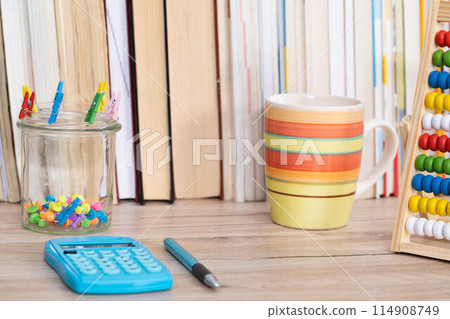 Desk of a young financier from elementary school. Mathematics is powerful knowledge. 114908749