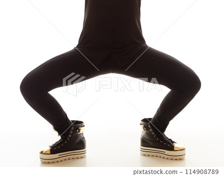 Teen fashion. Female legs in sneakers 114908789