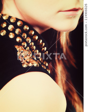 Close up part of woman face with stud collar Close up part of woman face with stud collar 114908826