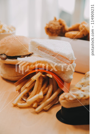 Closeup of home made burgers on wooden background 114909231