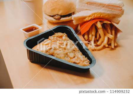 Multiple type of Fast food on table. 114909232