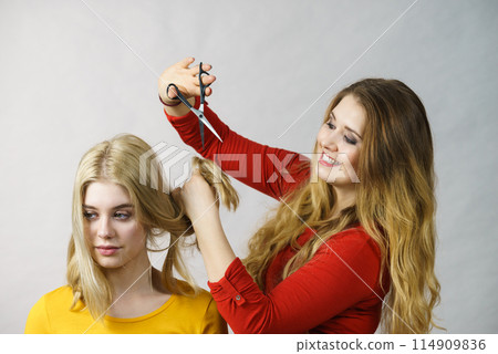 Woman with scissors ready to hair cutting 114909836