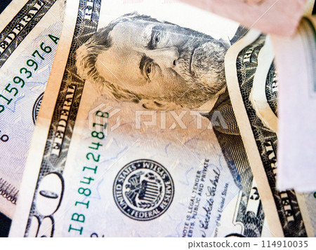 Currency Detail. Close view of a $50 notes security features and creases. Currency Detail. Close view of a $50 notes security features and creases. 114910035