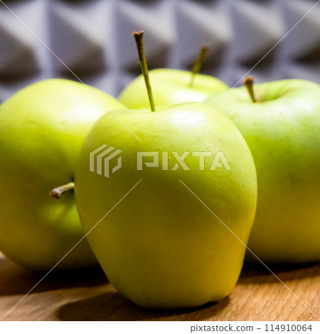 Ripe apples on wood, grey background, natural theme. Ripe apples on wood, grey background, natural theme. 114910064