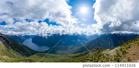Aerial Canadian Mountain Landscape. Sunny Cloudy Day. BC, Canada. Aerial Canadian Mountain Landscape. Sunny Cloudy Day. BC, Canada. 114911026