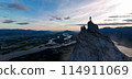 Adventurous Man Standing on top of Mountain Cliff. Extreme Adventure Composite. 3d Rendering Peak. 114911069