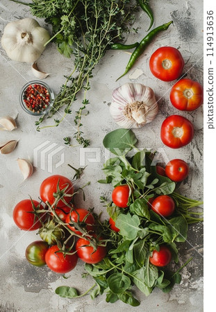fresh vegetables and herbs, grey background, top view fresh vegetables and herbs, grey background, top view 114913636