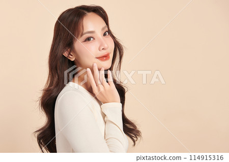 Beautiful young asian woman with clean fresh skin on beige background, Face care, Facial treatment, Cosmetology, beauty and spa, Asian women portrait. Beautiful young asian woman with clean fresh skin on beige background, Face care, Facial treatment, Cosmetology, beauty and spa, Asian women portrait. 114915316