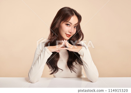 Beautiful young asian woman with clean fresh skin on beige background, Face care, Facial treatment, Cosmetology, beauty and spa, Asian women portrait. Beautiful young asian woman with clean fresh skin on beige background, Face care, Facial treatment, Cosmetology, beauty and spa, Asian women portrait. 114915320