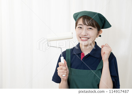 Female worker in house cleaning with carpet cleaner Female worker in house cleaning with carpet cleaner 114917487