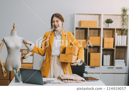 Portrait of Starting small businesses owners female entrepreneurs working on receipt box and check online orders to prepare to pack the boxes, sell to customers, sme business ideas online. 114919057