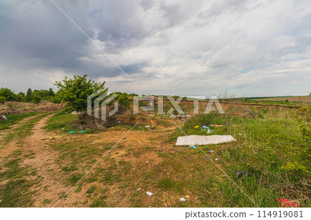 Pollution concept. Spontaneous uncontrolled landfill. Lytachi Ukraine 06.05.2024 114919081