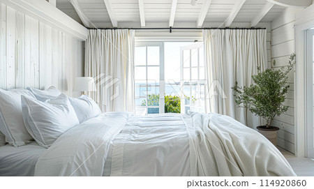 Beautiful interior of luxury bedroom with window sea view. Coastal cottage concept. High quality photo 114920860