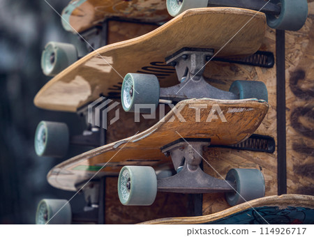A stack of skateboards on a special outdoor stand A stack of skateboards on a special outdoor stand 114926717