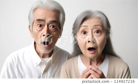 Elderly couple with surprised expressions Elderly couple with surprised expressions 114927216