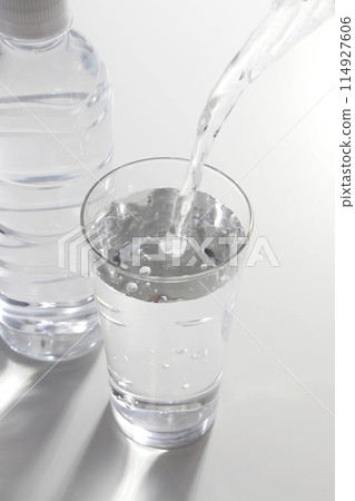 Mineral water poured into a glass Mineral water poured into a glass 114927606
