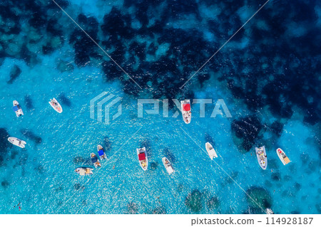 Aerial view on fast boats on blue sea at sunny day. Vacation and leisure. Aerial view on fast boats on blue sea at sunny day. Vacation and leisure. 114928187