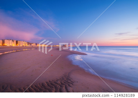Ostend, Belgium. Panoramic view of the sea coast during sunset. Ostend, Belgium. Panoramic view of the sea coast during sunset. 114928189
