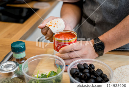 Chef at the kitchen preparing quesadillas with tofu and sweet corn 114928608