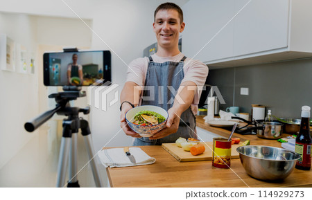 The chef is broadcasting live from workshop how to prepare a vegetarian food The chef is broadcasting live from workshop how to prepare a vegetarian food 114929273