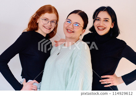 Sisters United: A Portrait of Family Love and Bonding on White Background 114929612