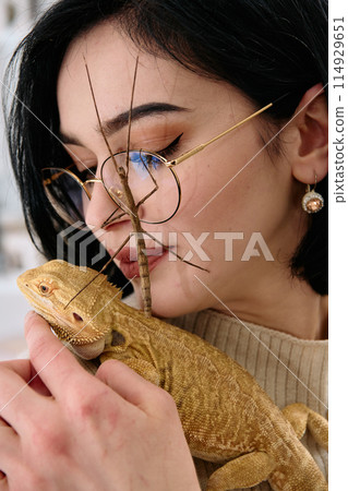 Woamn and Her Pets: A Bearded Dragon and a Stick Insect 114929651
