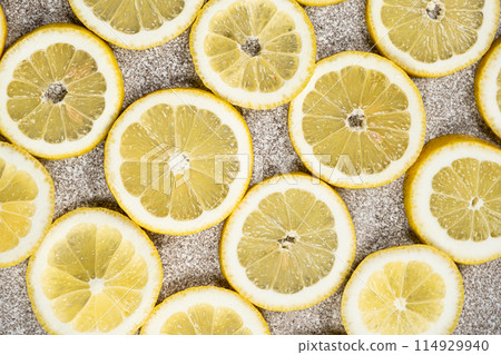 Bright citrus background of sliced fresh lemons top view. Bright citrus background of sliced fresh lemons top view. 114929940