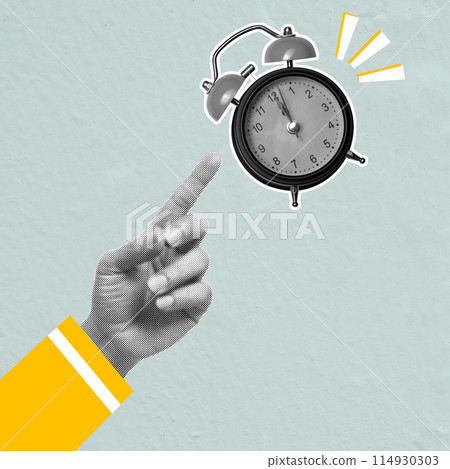 A human hand pointing an alarm clock A human hand pointing an alarm clock 114930303