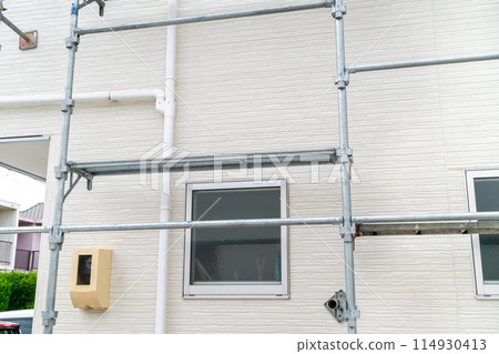 Photo of a Japanese house with scaffolding. Repairs. 114930413