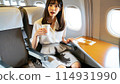 Woman spills drink on airliner 114931990