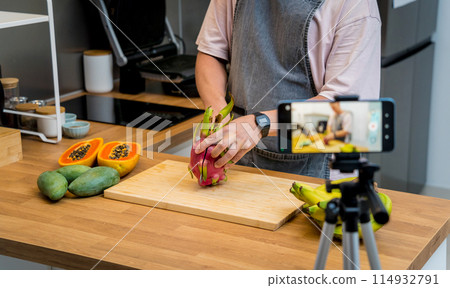 The chef is broadcasting live from workshop how to cuts and peels dragon fruit The chef is broadcasting live from workshop how to cuts and peels dragon fruit 114932791