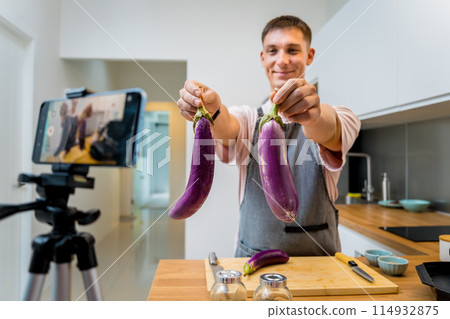 The chef is broadcasting live from workshop how to prepare a grilled eggplants with garlic The chef is broadcasting live from workshop how to prepare a grilled eggplants with garlic 114932875