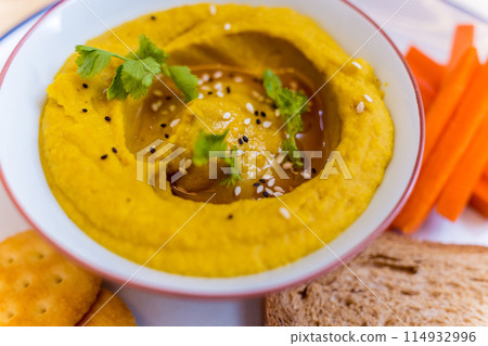 Nutritious and savory chickpea porridge with carrots Nutritious and savory chickpea porridge with carrots 114932996