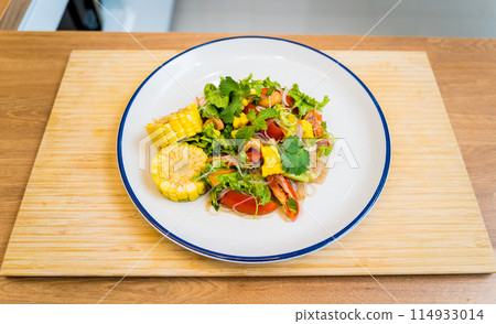Spicy glass noodle salad on the white plate Spicy glass noodle salad on the white plate 114933014