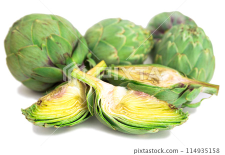 Green artichokes on white background Green artichokes on white background 114935158