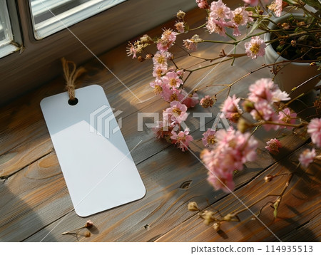 mockup photo of a blank white bookmark on top down view laying on the surface of a beautiful walnut table, 114935513