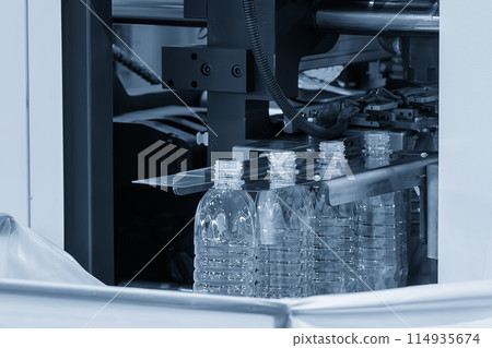 The drinking water bottle manufacturing process by blow mold machine. The drinking water bottle manufacturing process by blow mold machine. 114935674