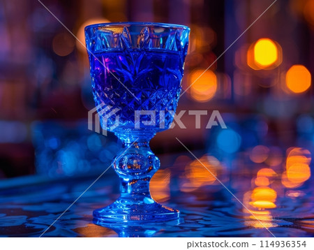 Blue Tropical Cocktail with Ice in Glass, Close-up 114936354