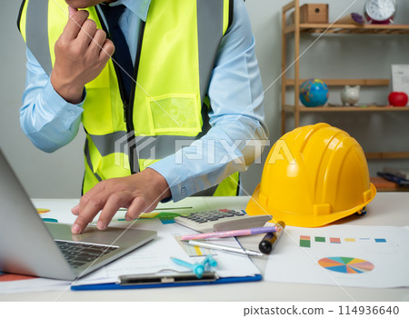 Architect or engineer using computer to work on desk, Cost calculation, Construction planning, Structural calculation, Construction cost planning, Structural design, Project presentation plan. Architect or engineer using computer to work on desk, Cost calculation, Construction planning, Structural calculation, Construction cost planning, Structural design, Project presentation plan. 114936640