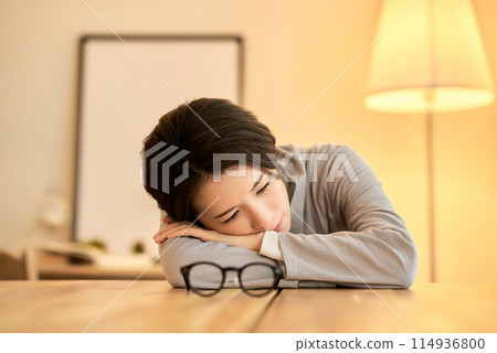 Woman resting in a room Woman resting in a room 114936800