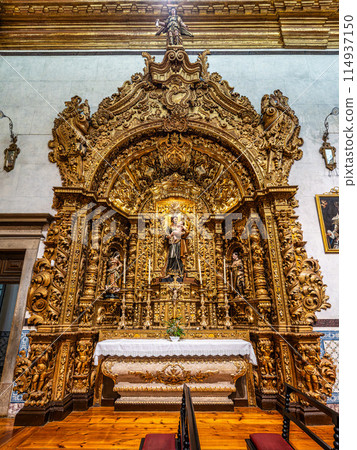 The intricate golden interior of the Carmelite church Igreja do Carmo in the old town of Faro in Portugal 114937150