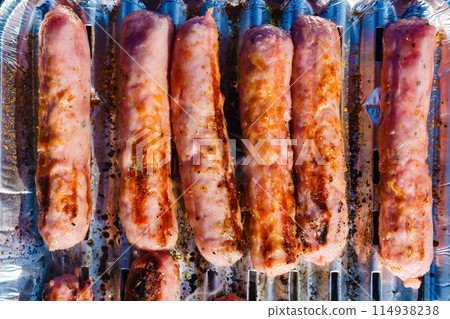Sausages meat grilling on gas grill Sausages meat grilling on gas grill 114938238