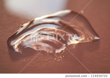 Beautiful volumetric drop of cosmetic product on a pink background. 114938720