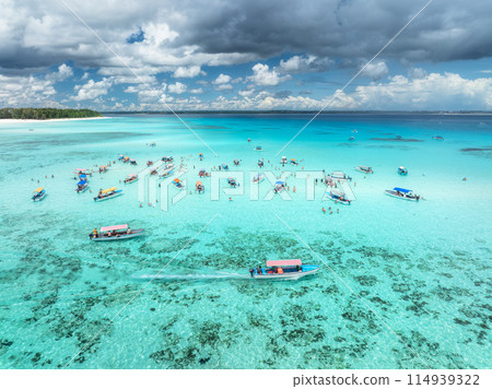 Aerial view of boats in clear azure sea in summer. Top view Aerial view of boats in clear azure sea in summer. Top view 114939322