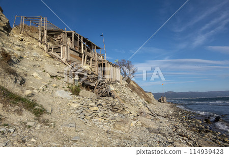 View of nice exotic wooden hut on beach Black Sea View of nice exotic wooden hut on beach Black Sea 114939428
