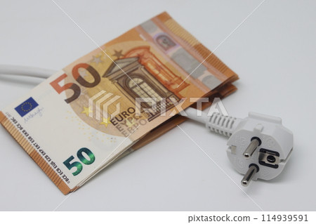 White electric cable and banknotes, expensive electricity, saving electricity. White electric cable and banknotes, expensive electricity, saving electricity. 114939591