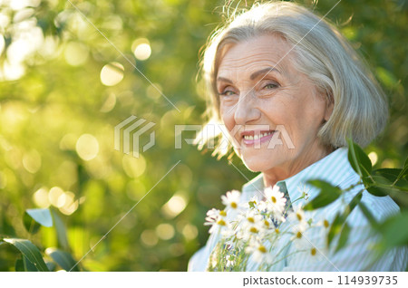 Portrait of a beautiful woman in the park in summer 114939735