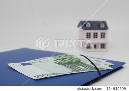 toy house and banknotes, buying your own home, mortgage, symbol of material well being. toy house and banknotes, buying your own home, mortgage, symbol of material well being. 114939809