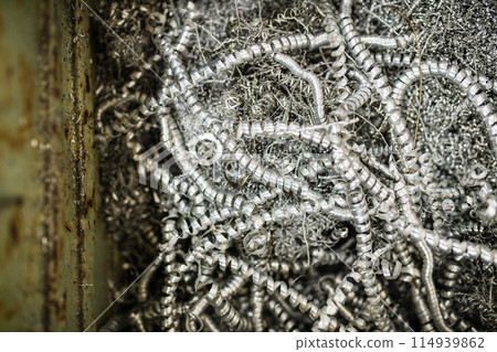 Iron filings after metal cutting. 114939862